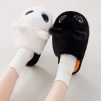 Тапочки chikoku Kawaii Eyes черные плюшевые с желтым смайлом-глазом и оранжевой стелькой фото
