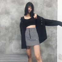 Женская юбка в черно белую клетку