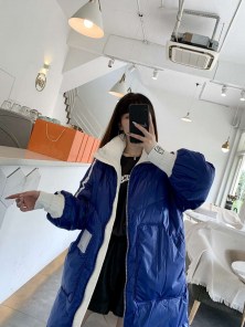 Длинный женский спортивный пуховик с полосками фото