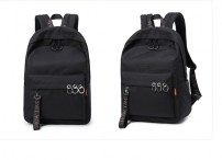 Черный рюкзак с металлическими пирсингом фото