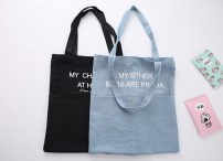 Вместительная тканевая сумка с большими карманами фото