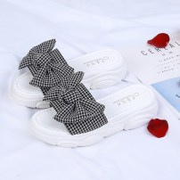 Тапочки с бантом в клетку на небольшой подошве фото