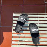 Резиновые черные тапочки с белой надписью Holiday фото